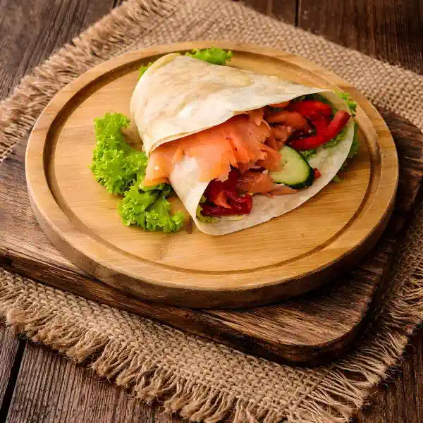 Tortilla with salmon, cucumber, tomato and lettuce